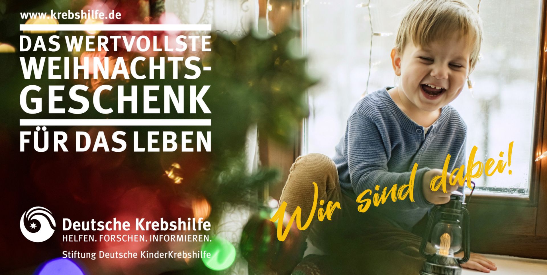 Bild mit einem Kind und der Aufschrift "Das wertvollste Weihnachtsgeschenk für das Leben" der Stiftung deutsche Kinderkrebshilfe und dem Text "Wir sind dabei"
